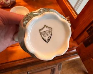 L23 - $35. Small Tea Set from "Sterling China". Teapot, creamer & sugar & 5 cups/saucers.