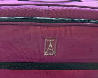 L63 - $60. TravelPro 28" Expandable. 4 Spinner wheels. Very good condition.