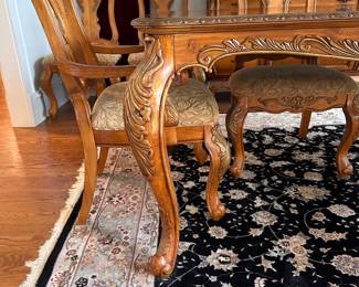 L2 - $375. Dining Table with 2 Captains Chairs, 4 regular chairs. Measures 6' long x 44" wide x 30" tall. 2 Leaves - 18" each. (Table can be 9' long full extended).