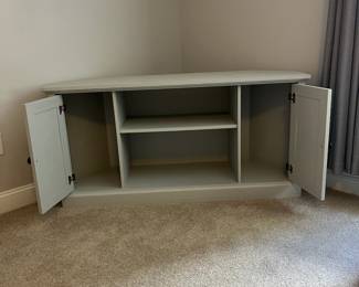 L34 - $60. Painted Media Stand. Measures 56.75" across the front x 18" x 28" tall. Very sturdy. Overall very good condition - does have a few minor paint scuff on the top. Was used in a corner for a TV stand.