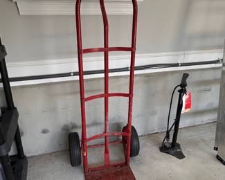 L94 - $40. Metal Dolly. Tires use air - not solid hard plastic. Good condition. No name / weight listed.