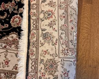 L80 - $125. Black & Ivory Area Rug. Measures 70" x 9'. Overall very good condition - was used in an office.