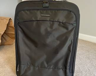 L36 - $75. The Briggs & Riley TU127X-8 Upright. Grey expandable suitcase. Measures 22" x 8.5" x 27.5" tall. Does NOT have spinning wheels. Has been used but still very good condition!