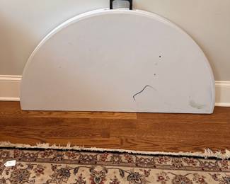 L82 - $40. 4' Round Plastic Folding Table with Carrying Handle.