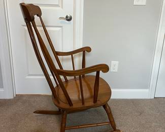 L42 - $35. Wooden Rocking Chair. Has been chewed by a puppy a long time ago. Still very sturdy, just a little nibble. As Is.