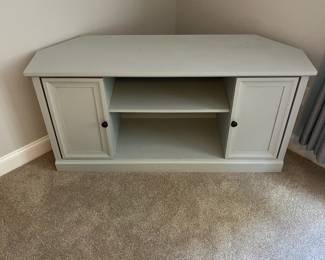 L34 - $60. Painted Media Stand. Measures 56.75" across the front x 18" x 28" tall. Very sturdy. Overall very good condition - does have a few minor paint scuff on the top. Was used in a corner for a TV stand.