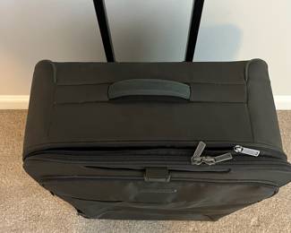 L36 - $75. The Briggs & Riley TU127X-8 Upright. Grey expandable suitcase. Measures 22" x 8.5" x 27.5" tall. Does NOT have spinning wheels. Has been used but still very good condition!