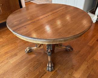 L10 - $350. Round or Oval Solid Wood Dining Table. Has carved lions on the base. Measures 48" round x 29.5" tall. 2 leaves are 11.5" each. I believe this is Hastings Table Co. or RJ Horner. Both made similar tables in the late 1800s. Table top isn't terrible but has a few marks here and there. Sturdy & very useable as is!