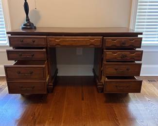 L73 - $30. Office Desk with Chair. All drawers slide as they should. A bit of wear along the base but overall very good condition.