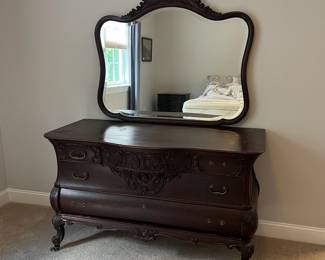 L8 - $475. Believed to be RJ Horner. Figural Carved Framed Mirror. Has dovetailed, Birdseye Maple lined drawers. Needs new handles, but all drawers are solid, quite heavy and slide perfectly! Antique Dresser from NYC. Measures 55.5" x 26" deep x 33" tall. Mirror is 45" x 41". 74" tall assembled. Has 2 small holes on the top that look original but I'm not sure what is supposed to go in them.