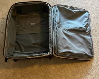 L36 - $75. The Briggs & Riley TU127X-8 Upright. Grey expandable suitcase. Measures 22" x 8.5" x 27.5" tall. Does NOT have spinning wheels. Has been used but still very good condition!