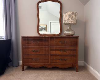 L16 - $125. Bassett Furniture Dresser with Mirror. Measures 52.5" wide x 17.75" deep x 31.75" tall. Mirror is 26" x 37". Mirror is NOT attached and is wall hanging. All drawers slide easily. Minor surface wear / marks.