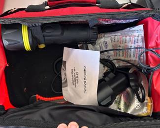 L100 - $15. Bridgestone Auto Emergency Kit. Jumper Cables, air pump & other accessories.