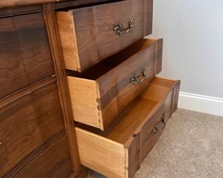 L16 - $125. Bassett Furniture Dresser with Mirror. Measures 52.5" wide x 17.75" deep x 31.75" tall. Mirror is 26" x 37". Mirror is NOT attached and is wall hanging. All drawers slide easily. Minor surface wear / marks.