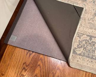L110 - $30. Ruggable style rug with pad. 4' x 6' size.