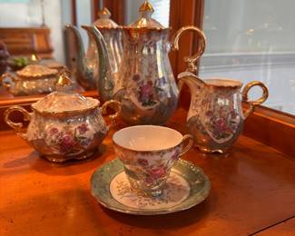 L23 - $35. Small Tea Set from "Sterling China". Teapot, creamer & sugar & 5 cups/saucers.