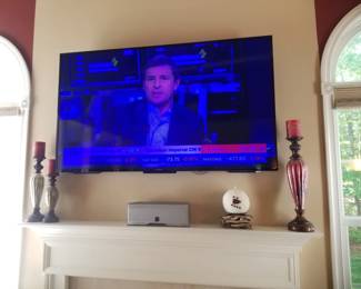 SONY flat screen TV with bracket; decorative candlesticks