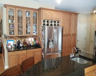 Kitchen includes a pantry; custom wine rack & leaded glass front cabinets. LG refrigerator mfg. 10/2013