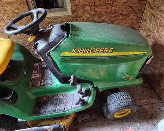 John Deere LT150 riding mower (has damage on front end & won't crank)