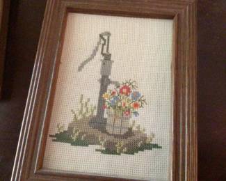 Homemade needlepoint wall hangings