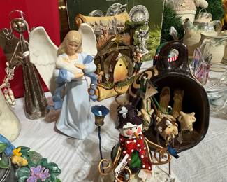 Collection of Decorative Christmas Figurines: Nativity Scene, Angel, and Snowman