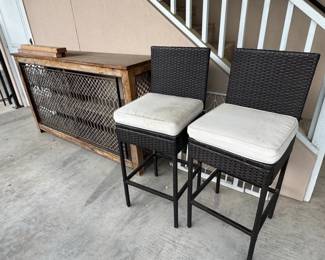 Set of Dark Brown Wicker Bar Stools with OffWhite Cushions and Distressed Wood Console Table