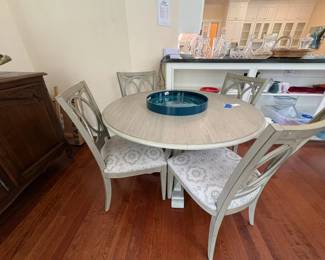 New Classic Furniture Cori piece in. Wood Top Round Dining Set