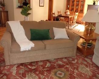 SOFA SOFT TAN  - LARGE AREA RUG RED & TAN - PINE END TABLE - BRASS  TABLE LAMP