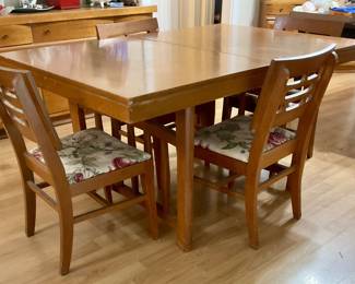 Table with chairs, has butterfly leaf