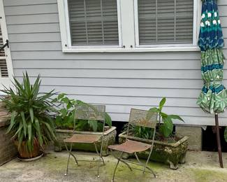 Planters and folding bistro chairs
