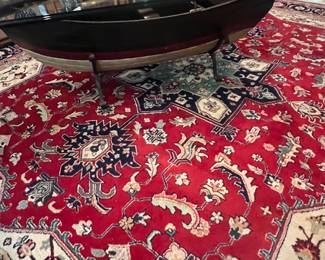 Closeup row boat w oars coffee table , large wool area rug 