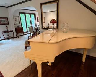 White lacquer baby grand piano 