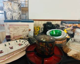 orning cookware and bakeware Anchor Hocking serving plates Glass baking dishes Mixing and serving bowls Holiday-themed serving trays Decorative mug gift set Wicker serving basket FryDaddy countertop fryer Lacquer-style serving container Assorted kitchen and dining accessor