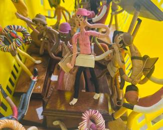 Assorted handmade string art figures Multiple character sculptures on wooden bases Folk art and artisan-crafted decorative pieces Various sizes, colors, and poses