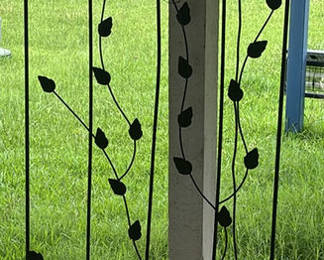 Lot 117: Assorted Metal Garden Decor and Planters