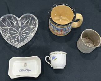 Lot 204: Assorted mugs, heart-shaped crystal dish, and decorative dishes