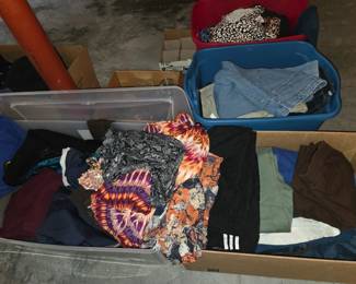 Bins and boxes of clothing - many with tags