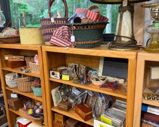 Miscellaneous boxes, postcards, sewing baskets full of sewing supplies. 