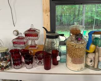 Ruby Flash Souvenir glassware. Lamp Oil dispenser, pressed glass inside wire form for pouring. Very old. Glass jar filled with samples of wool. 