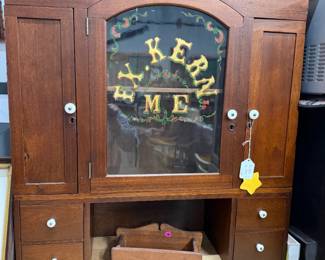 F.X. Kern, M.E. (Medical Examiner) cabinet. Restored, solid walnut, original reverse painting, 29"w. by 32"t by 10" d. Could hang on the wall.