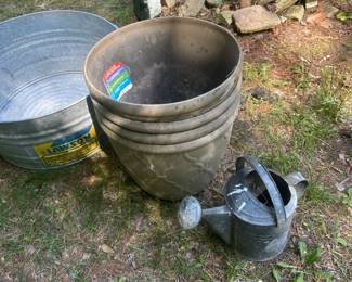 Misc planters, heavy plastic. Vintage galvanized watering can.