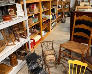 Lots of children's chairs, doll items and sewing baskets.