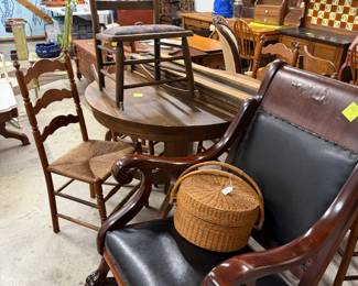 Large rocker. Round oak table next, 42" diameter by 30" t. Miscellaneous chairs. 
