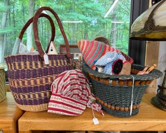 Sewing basket full of supplies. Hand made colorful hat. 