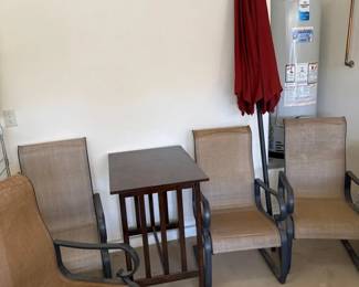 Outdoor Chairs, Table, And Umbrellas