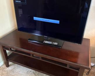 A Samsung Tv And Tv Stand