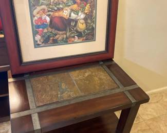 Small Side Table And A Framed Picture