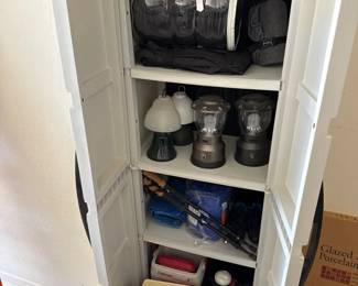 A Cool Cabinet With Some Camping Stuff