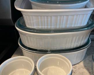CorningWare French White Bakeware Set with Glass Lids and Ramekins in Racks