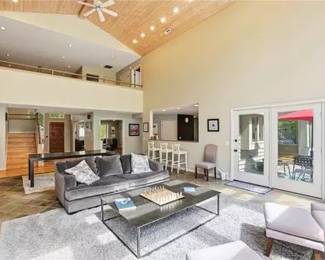 Couch, metal coffee table, bar stools